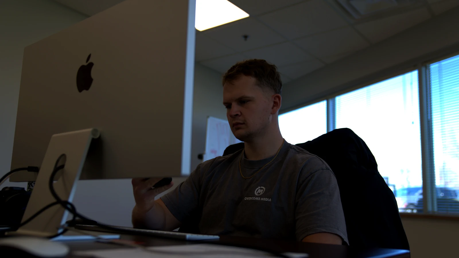 Overcome Media team member planning digital marketing strategy at the Lexington office