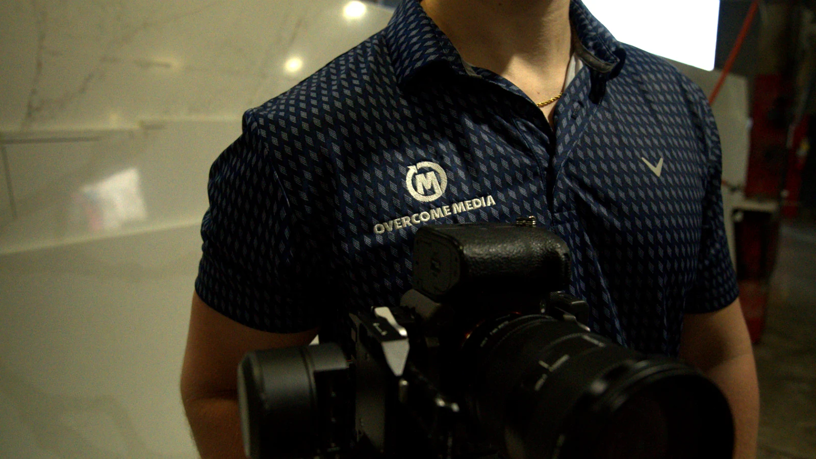 Overcome Media professional video production camera and branded team member