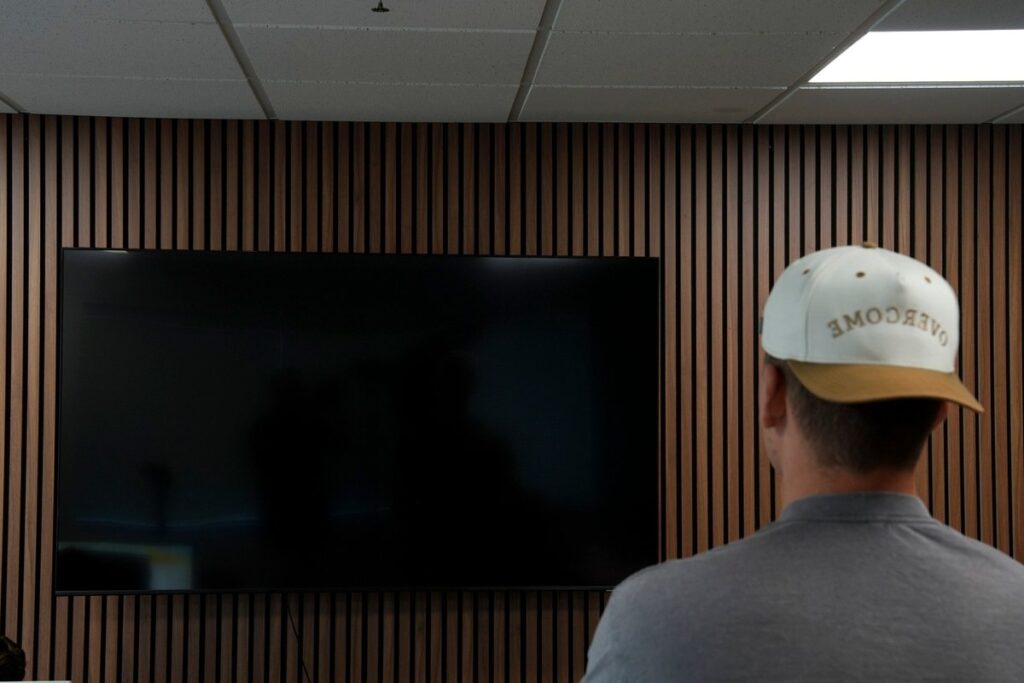 Overcome Media team member reviewing website strategy in a conference room